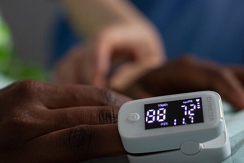 A pulse monitor on a patient's finger